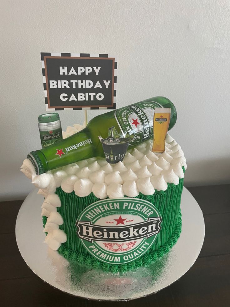 a birthday cake decorated with beer and marshmallows