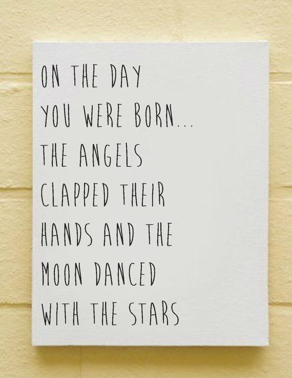 a sign on the side of a building that says, on the day you were born the angels clapped their hands and the moon dance with the stars