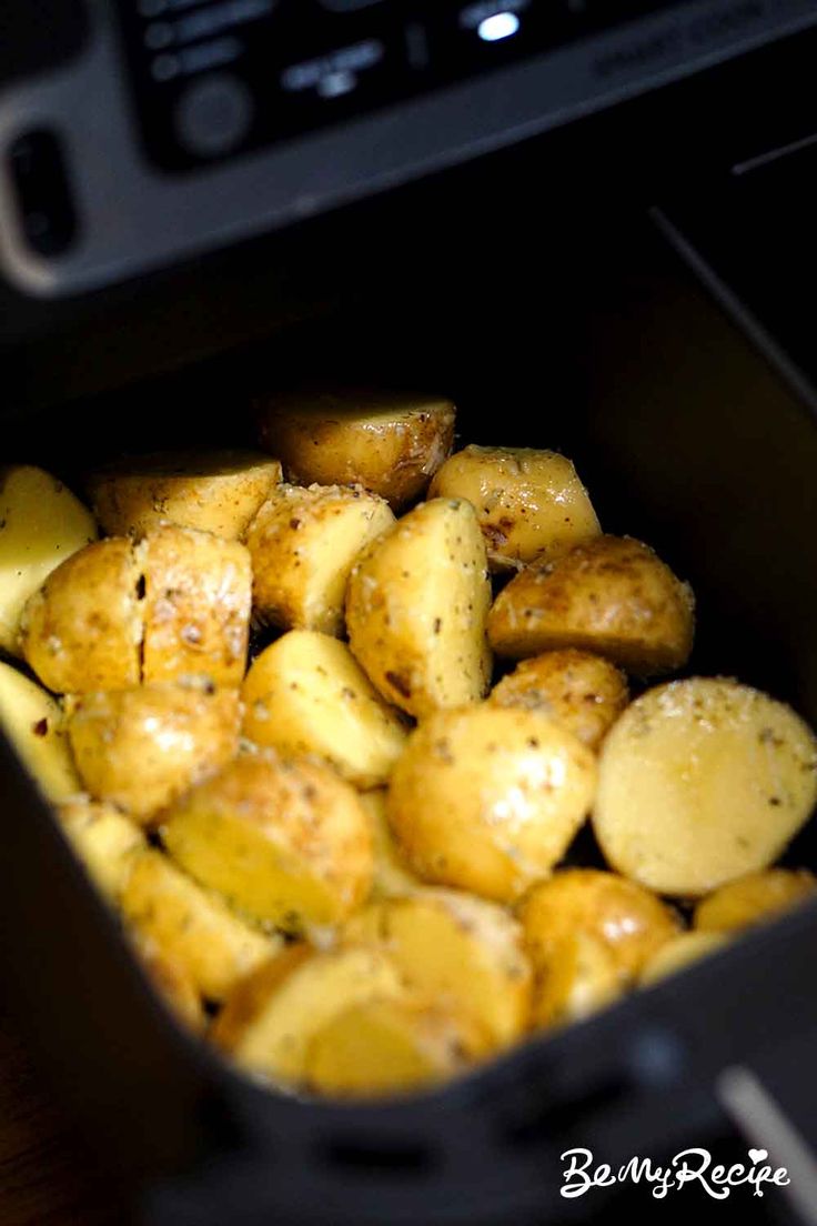 cooked potatoes in an air fryer with seasoning