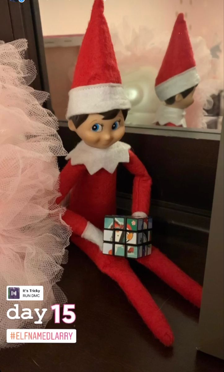 an elf is sitting next to a mirror