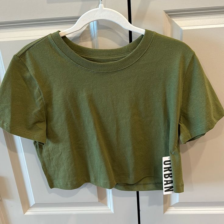 Urban Outfitters Top Size Medium Color Says It Is Khaki On The Tag, But It Looks More Like Army Green To Me Green Casual T-shirt By Urban Outfitters, Casual Green T-shirt By Urban Outfitters, Urban Outfitters Green Casual T-shirt, Green Cropped T-shirt For Everyday Wear, Green Crew Neck Top From Urban Outfitters, Urban Outfitters Green Cotton Tops, Urban Outfitters Green Crew Neck Top, Casual Green Top From Urban Outfitters, Green Relaxed Fit Trendy Crop Top