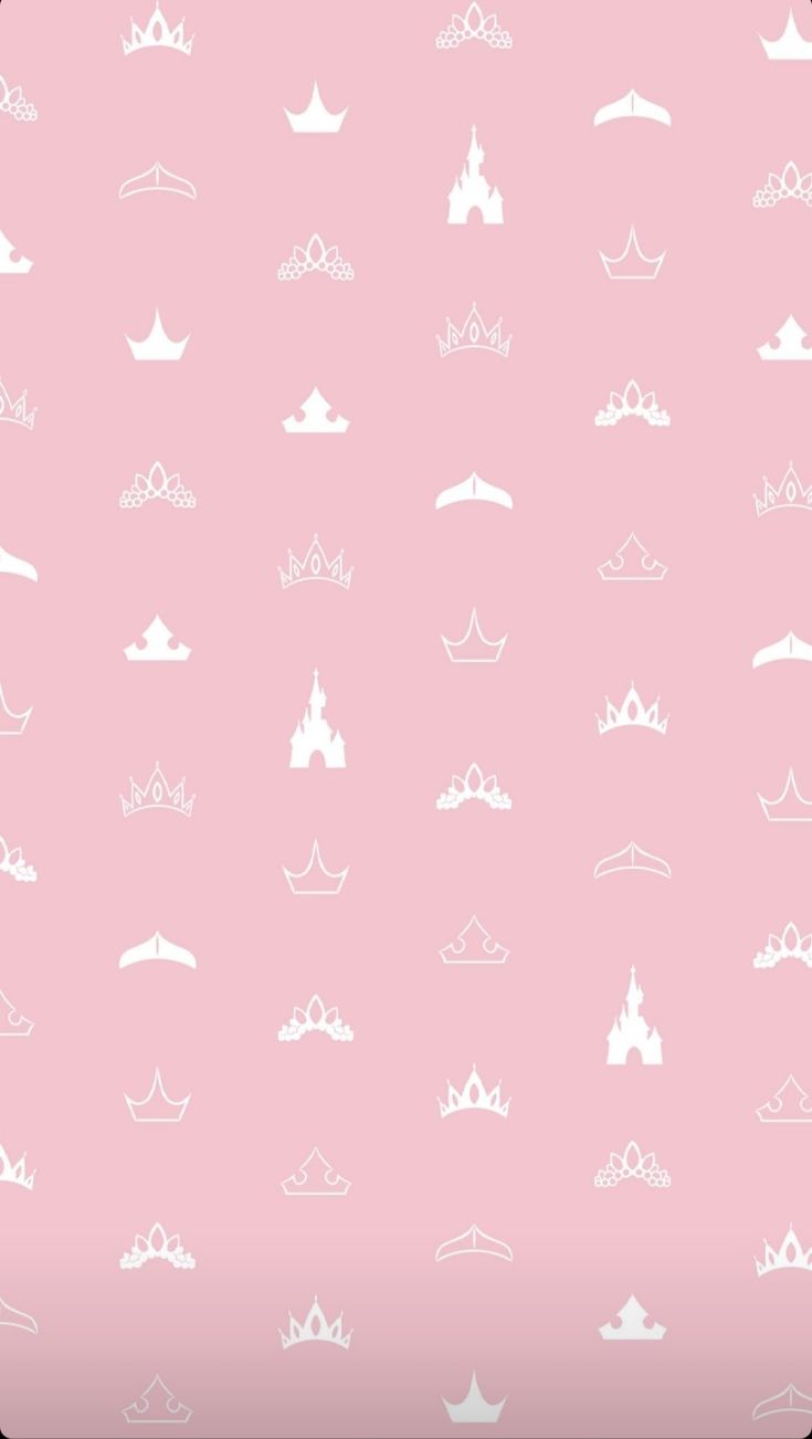 a pink background with white crowns and clouds in the sky on top of each other