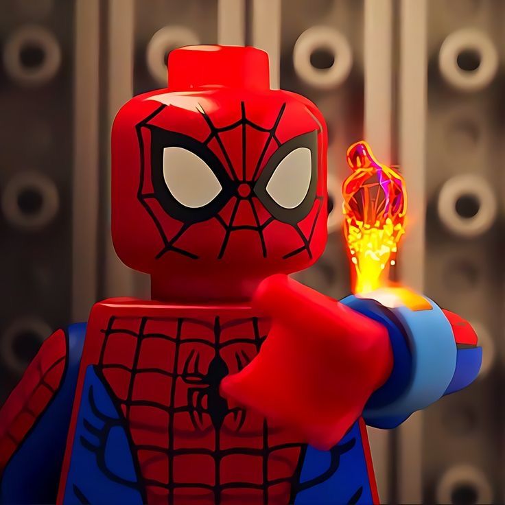 the lego spider - man character is holding a glowing object