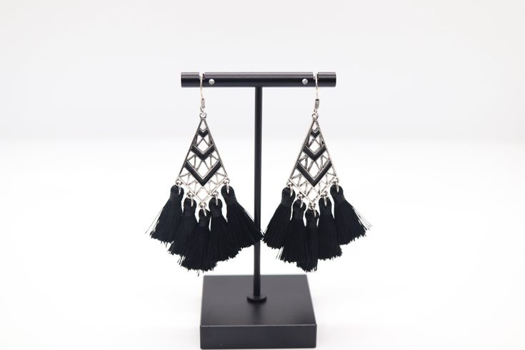 The Silver and Black Tassel Earrings showcase a striking contrast with their silver base and stylish black tassels, creating a chic and contemporary look. These earrings effortlessly blend sophistication with a touch of edge, making them a versatile accessory to elevate your fashion ensemble. Silver Tassel Earrings For Evening, Black Tassel Drop Earrings, Black Tassel Earrings For Party, Trendy Black Fringe Jewelry, Elegant Black Tassel Drop Earrings, Black Fringe Tassel Drop Earrings, Elegant Black Dangle Tassel Earrings, Black Tassel Drop Earrings For Evening, Black Fringe Drop Earrings