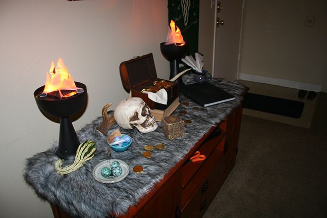 there is a table with some items on it and fire coming out of the top