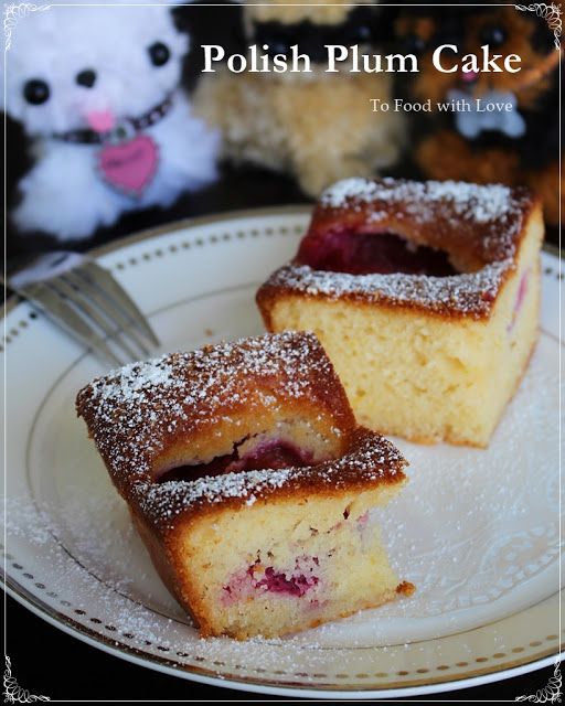 two pieces of cake sitting on top of a white plate next to a stuffed animal