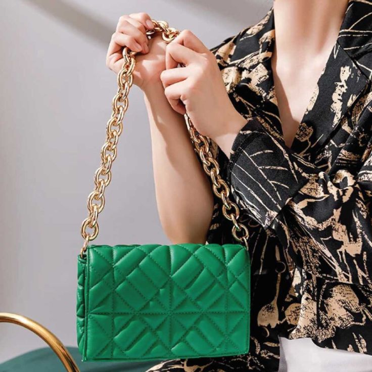 This petite quilted bag is about to become your best friend.Compact with oversized gold chain for a cocktail look. Remove the chain and you've got a trendy clutch. Soft vegan leather with secure snap-on flap Care Instructions: Use a soft damp cloth to wipe down any spills or stains for both the interior and exterior of the bags. Product Specifications: - Quilted design - Chunky gold chain - Secure snap-on flap - Carry it as a clutch by removing the chain strap Chic Quilted Green Bags, Chic Green Quilted Bag, Quilted Clutch For Evening, Trendy Clutch With Chain Strap For Night Out, Chic Quilted Clutch For Everyday Use, Chic Quilted Evening Clutch, Green Clutch With Chain Strap, Chic Quilted Flap Bag For Evening, Trendy Quilted Evening Shoulder Bag