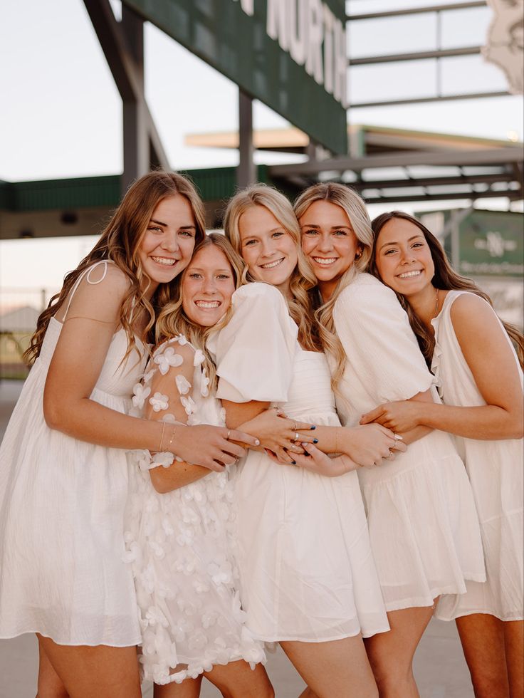 a group of young women standing next to each other