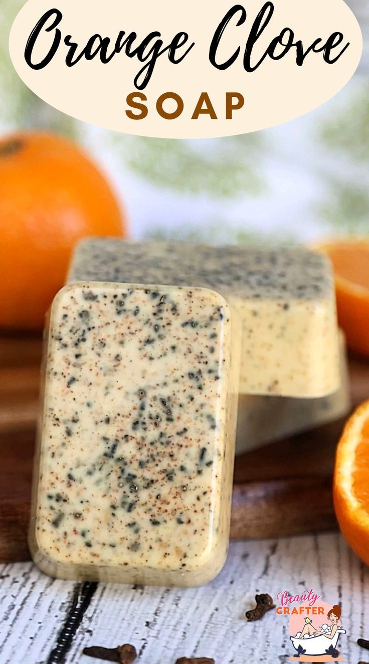 orange grove soap on a cutting board next to an orange slice