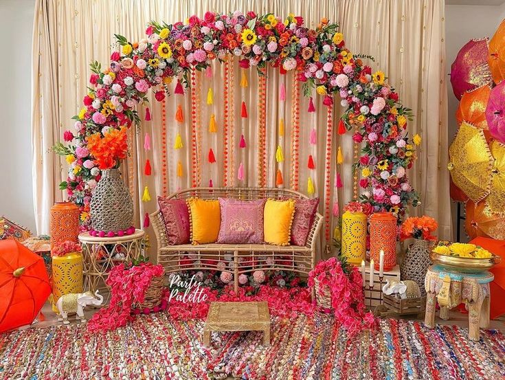 a decorated stage with lots of flowers and decorations