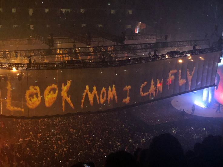 an aerial view of a crowd at a concert with the words look mom schley written on it