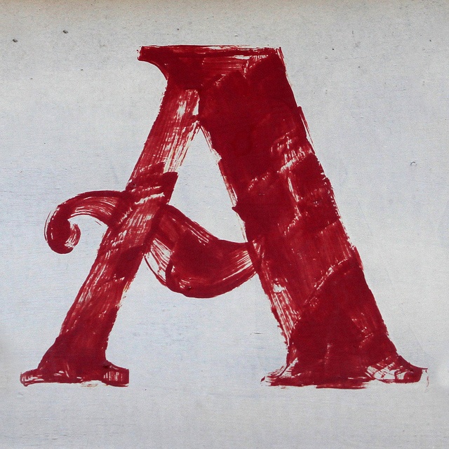 the letter a is drawn with red crayons