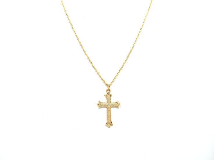 "Our diamond cut gold cross pendant necklace is meticulously handcrafted with authentic 14K yellow gold. This religious pendant necklace features an intricate floral design that's perfectly matched with a polished and durable solid 14K gold rope chain. CROSS PENDANT NECKLACE * Minimal gold cross for everyday wear * Unique diamond cut surface * Handmade with real 14K Yellow Gold NECKLACE DETAILS * Pendant Size: 26 mm x 18 mm * Pendant and Chain Material: 14K Yellow Gold * Chain Type: Rope * Chain Yellow Gold Cross Necklace For First Communion, Yellow Gold Cross Charms For Baptism, Yellow Gold Cross Pendant For First Communion, Yellow Gold Cross Pendant Necklace For First Communion, Yellow Gold Cross For Baptism, Yellow Gold Cross Pendant For Baptism, Yellow Gold Cross Pendant Necklace For Baptism, 14k Gold Cross Pendant Necklace For First Communion, Yellow Gold Cross Necklaces For Baptism