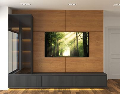 an empty room with a television on the wall