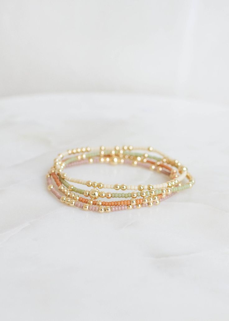 "❖Olivia Bracelet❖ * Your new favorite bracelet! Delicate and minimalistic, perfect for stacking! ‣ This listing is for a single bracelet. ‣ Buy more, save more - applied at checkout      * 3 10% off      * 5, 15% off      * 7, 20% off ‣ Olivia bracelet features: * 2mm Seed Beads * 3mm 14k Gold Filled Beads in random order * 1-5m 14k Gold Filled Bead Julisa Bracelets Feature:  ‣ Tight/Sturdy elastic, pre-stretched to prevent bracelet from stretching out ‣ Sizing according to wrist size ‣Sizing T Olivia Bracelet, Gold Bracelets Stacked, Single Bracelet, Bracelets Ideas, Market Jewelry, Preppy Jewelry, Jewelry Accessories Ideas, Gold Bead Bracelets, Jewelry Essentials