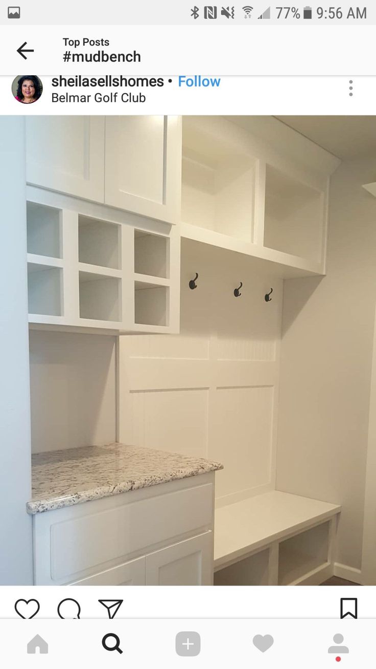 a room with white cabinets and marble counter tops on the bottom shelf is instagramted