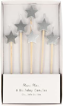 four silver stars on sticks in a box with the words new me 6 birthday candles