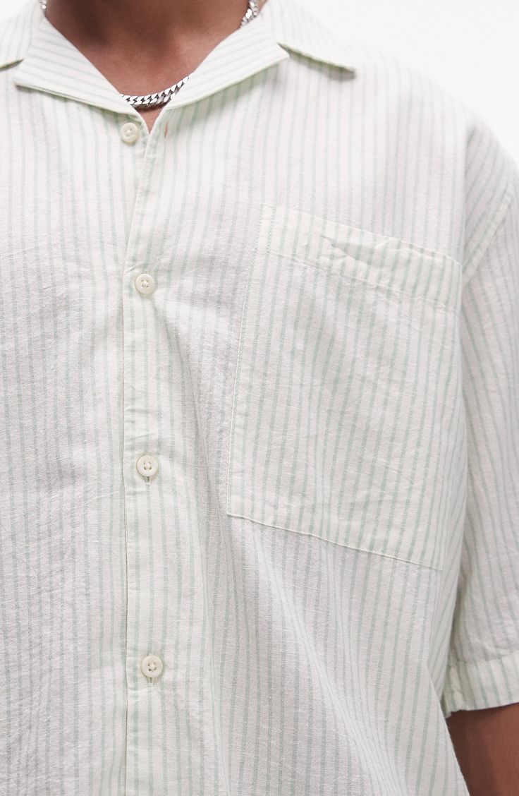 Roomy and relaxed, this camp shirt cut from lightweight cotton sports pale pinstripes and a casual, wear-everywhere vibe. 29" length; 46" chest (size Medium) Front button closure Notched collar Elbow-length sleeves Chest patch pocket 100% cotton Machine wash, line dry Imported Casual Relaxed Fit Camp Shirt For Daywear, Relaxed Fit Pinstripe Cotton Tops, Striped Cotton Camp Shirt For Spring, Casual Cotton Camp Shirt For Daywear, Pinstripe Cotton Tops With Relaxed Fit, Casual Striped Camp Shirt With Camp Collar, Casual Striped Camp Shirt For Spring, White Unstructured Casual Camp Shirt, Pinstripe Shirt With Relaxed Fit And Short Sleeves