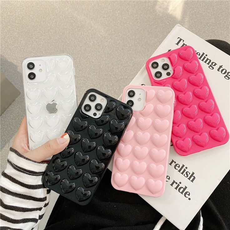 three cell phone cases with hearts on them