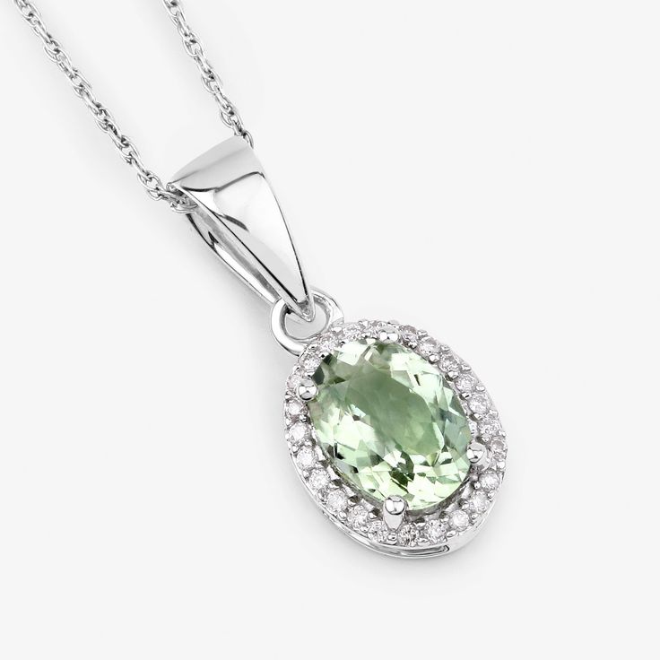 "14K Gold Green Tourmaline Pendant, Genuine Olive Green Tourmaline and Diamond White Gold Pendant, Bridal Wedding Pendant, October Birthstone Portray forever with our breathtaking necklace. A sweet halo pendant necklace, perfected with the touch of exquisite craftsmanship. Glorious 1.27 ct. t.w. oval green tourmaline gemstones set in fine finish 14k white gold suspended from a Sterling Silver makes this pendant necklace an ideal gift for the baby in your life. A 14k gold green tourmaline pendant Wedding White Gold Gemstones With Diamond Accents, Fine Jewelry Gemstones With Diamond Accents For Wedding, Wedding Fine Jewelry Gemstones With Diamond Accents, Wedding Diamond Gemstones In White Gold, Green Gemstones With Accents For Wedding, Exquisite Oval Gemstones For Wedding, Oval Cubic Zirconia Gemstones For Wedding, Oval Diamond Gemstones For Weddings, Dazzling Wedding Necklace With Center Stone