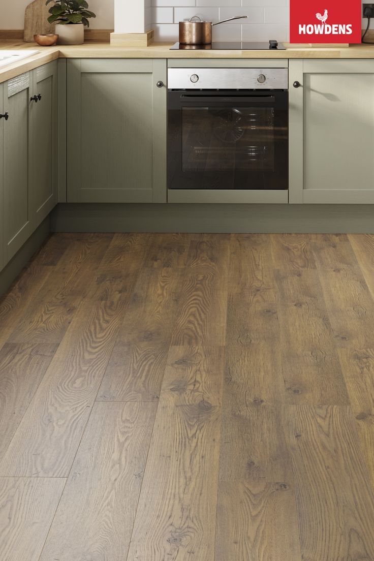 an image of a kitchen setting with wood flooring on the counter top and cabinets