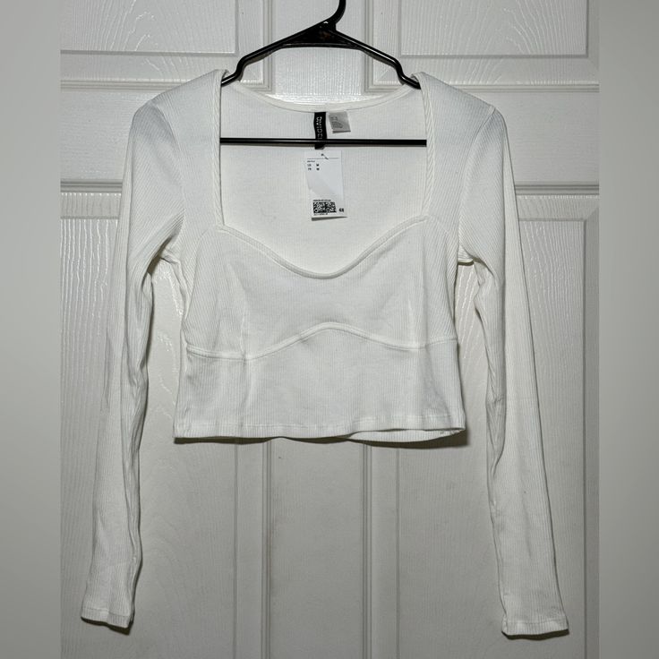 H&M Women’s White Crop Top In Size Medium! Brand New With Tags! Please Let Me Know If You Would Like Additional Photos. Bundle Multiple Items For Discounted Shipping! H&m Cotton V-neck Tops, H&m V-neck Cotton Tops, H&m Fitted Crop Top, Trendy Cropped Tops By H&m, H&m Fitted Casual Crop Top, Fitted H&m Crop Top, H&m Long Sleeve Tops For Day Out, Fitted White Top From H&m, Trendy Fitted H&m Tops