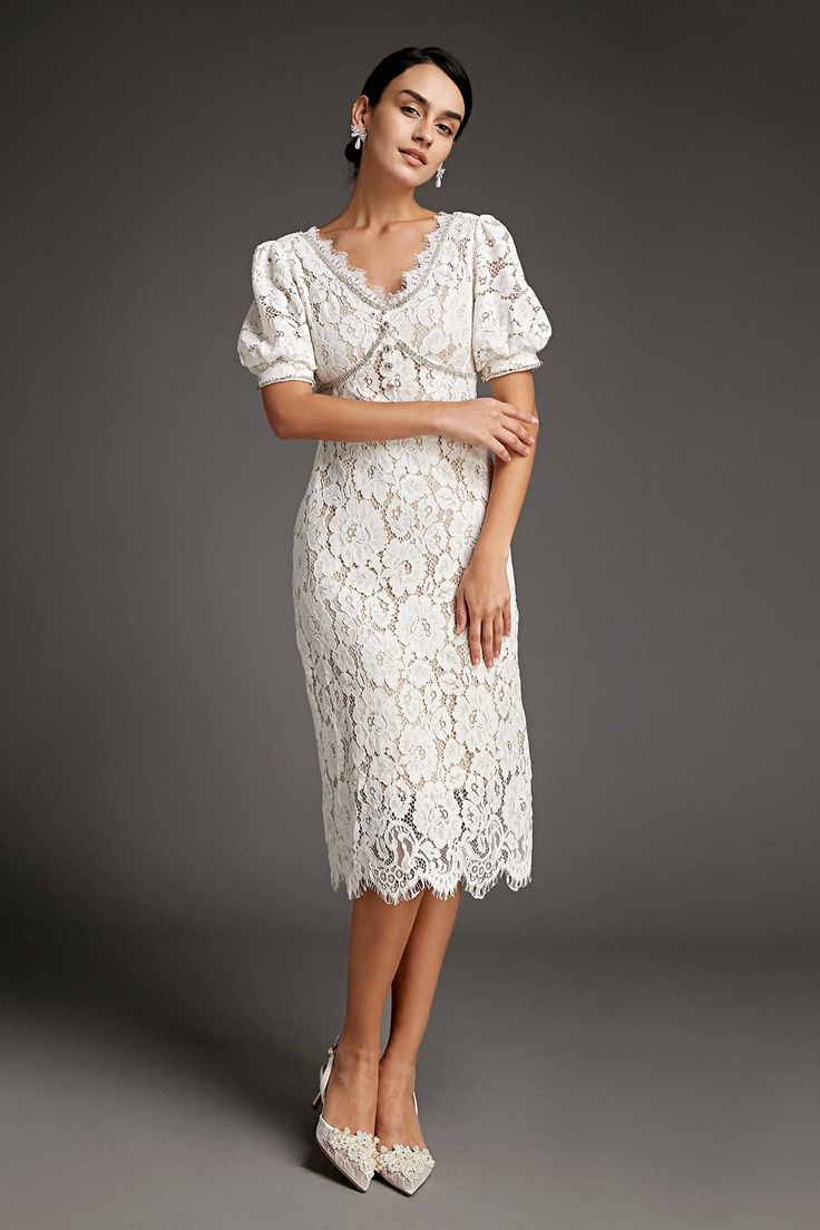 This lace crochet V-neckline midi dress will fill any of your little white dress needs, from your bridal shower to your after party. The textured lace overlay, accented with thick embroidery that outlines the lace’s blooms. Also features puff sleeves and delicate scalloped eyelash lace hem. The rhinestone trim and buttons adds an extra glitz and glam. No Stretch Medium Weight Size runs small,recommend one size up Fabric: 100% Polyester,Lining: 100% Polyester Model is 174cm/5'7" tall, 81cm/32" bust, 61cm/24" waist and 90cm/35" hip and wears a size S. Care Instruction: Hand Wash, Do not bleach, Dry flat in shade, Iron cool (max 110â„?, Dry clean, tetrachloroethylene(PCE) only.Please note: The images represent actual product though color of the image and product may slightly differ. This item Thick Embroidery, Modest Midi Dress, Vintage Dress Design, Little White Dress, Cap Dress, Rhinestone Trim, Korean Dress, Lace Crochet, Lace Hem