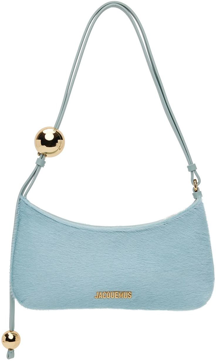 Cow hair shoulder bag in blue. · Beaded accents at adjustable leather shoulder strap · Logo hardware at face · Zip closure · Card slot at interior · Cotton twill lining · Logo-engraved gold-tone hardware · H5.5 x W10.5 x D1 Part of the Les Sculptures collection. Supplier color: Light blue Luxury Classic Light Blue Shoulder Bag, Luxury Trendy Light Blue Bag, Blue Purse Outfit, Cute Shoulder Bags, Designer Blue Shoulder Bag For On-the-go, Night Out Bag, Jacquemus Bag Blue, Luxury Blue Shoulder Bag For On-the-go, Purse Outfit