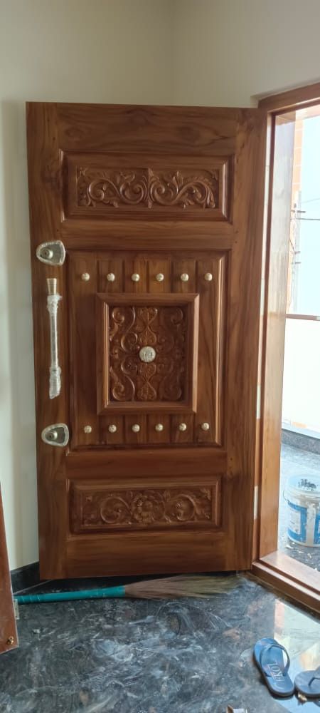 a wooden door is shown in front of a window