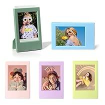 four different colored frames with pictures of people in them and one is holding a flower