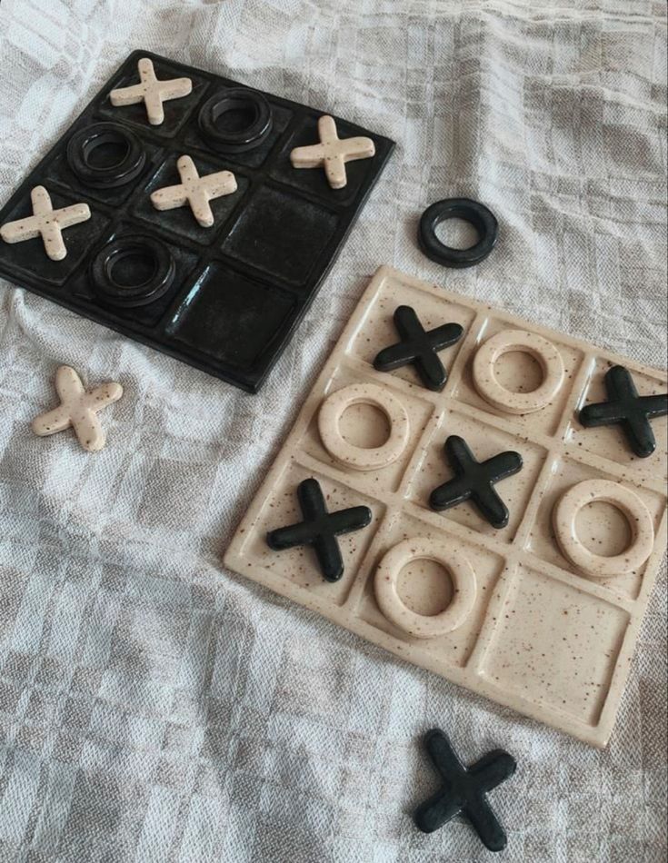 an assortment of toys like tic - tacs and doughnuts on a bed