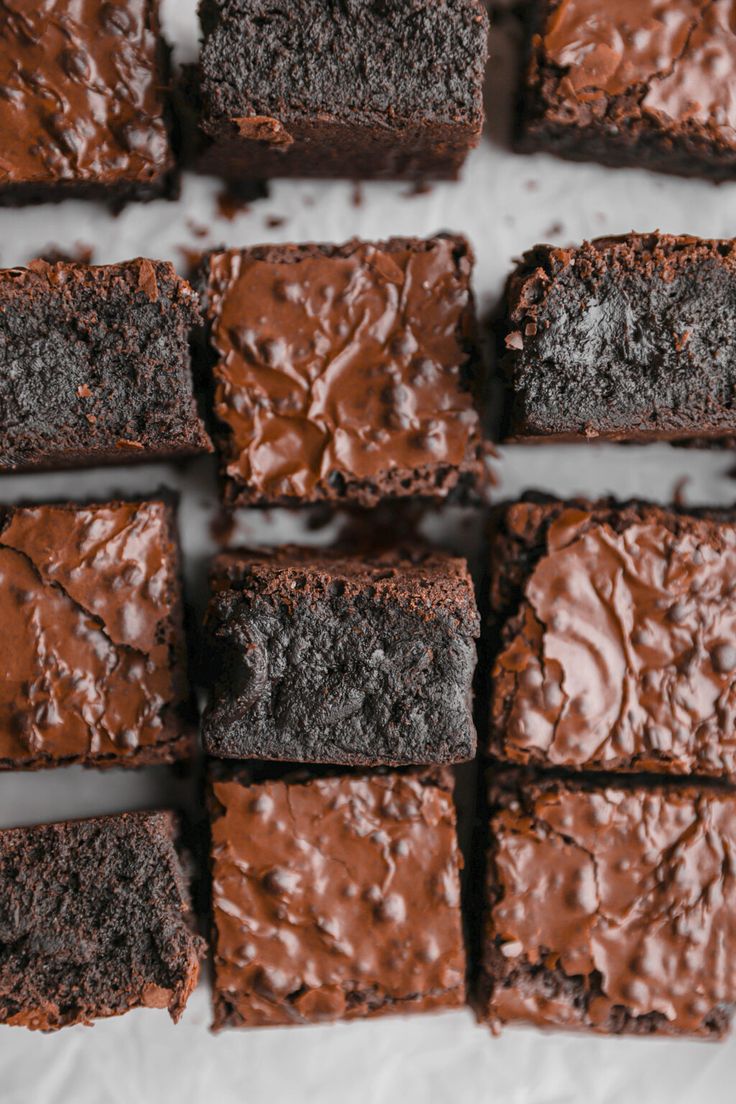 brownies with chocolate frosting are arranged in rows