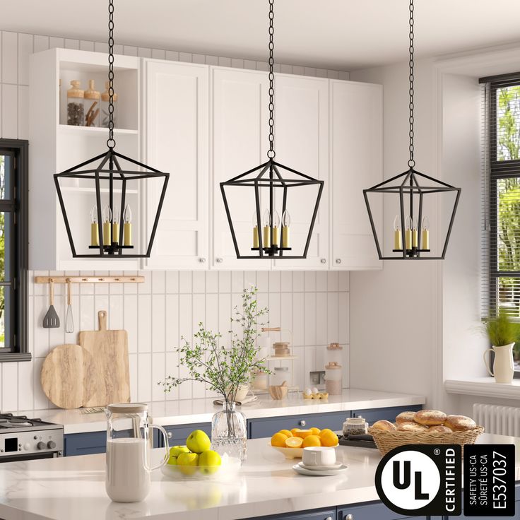 the kitchen is clean and ready to be used for cooking or baking, with hanging lights over the island