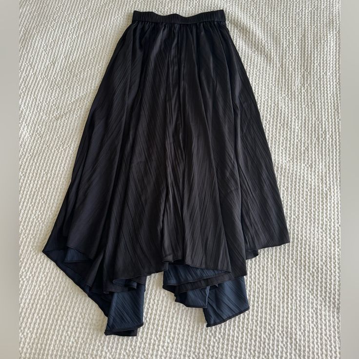 Anthropologie Black Midi Skirt Black Asymmetrical Skirt For Spring, Black Flared Pleated Skirt, Black Skirt With Elastic Waistband For Evening, Long Skirt With Elastic Waistband For Night Out, Elastic Long Skirt For Night Out, Black Lined Relaxed Skirt Bottoms, Black High Waist Relaxed Skirt, Black High Waist Relaxed Fit Skirt, Relaxed High Waist Black Skirt