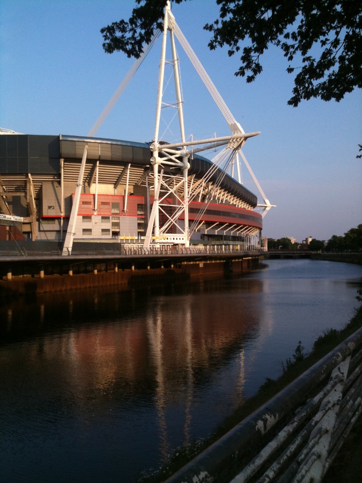 a large building sitting next to a body of water