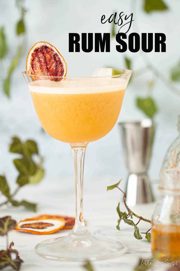 an easy rum sour cocktail garnished with grapefruit