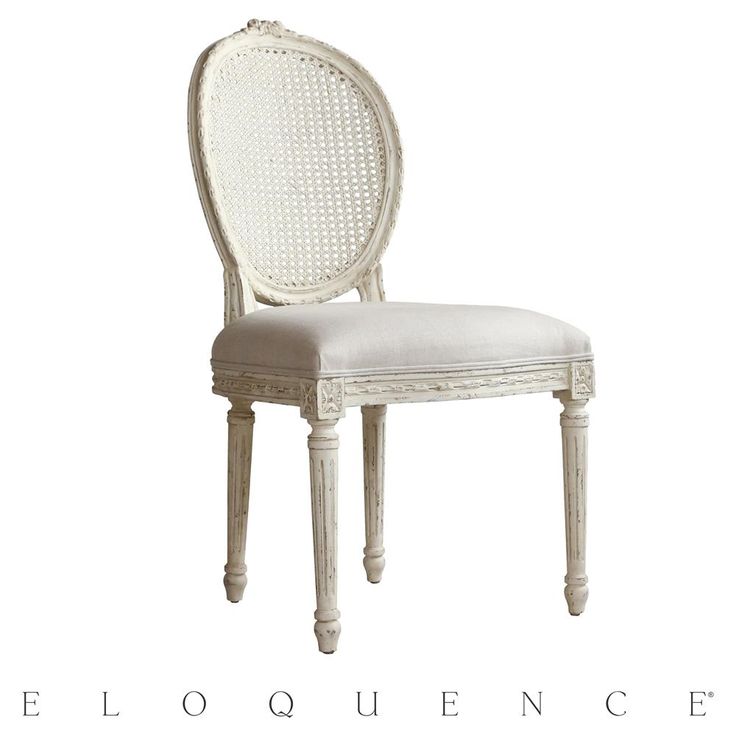 a white chair with a cushion on the seat and backrest, in front of a white background