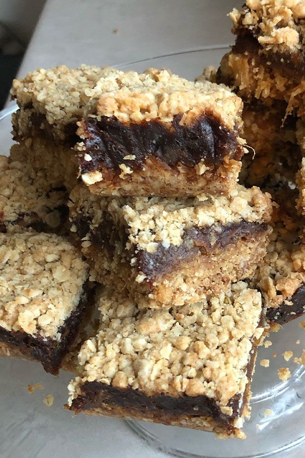 a glass plate filled with oatmeal and chocolate bars