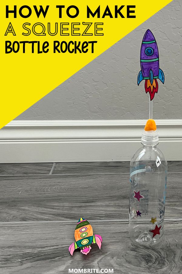 a bottle with a rocket ship in it sitting on the floor next to a magnet