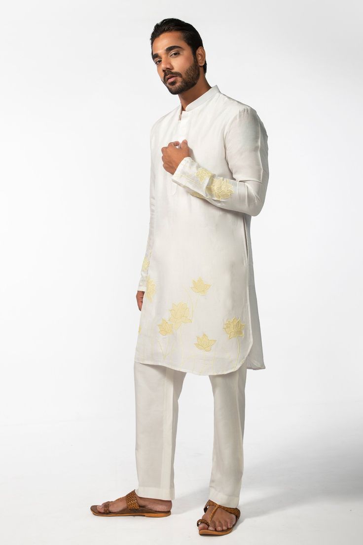 Ivory full sleeve kurta with yellow applique embroidery in geometric pattern and mandarin collared neckline. Paired with pant pyjama.
Components: 2
Pattern: Embroidery
Type Of Work: Applique
Neckline: Mandarin collar
Sleeve Type: Full sleeves
Fabric: Kurta: Bam Silk, Pant Pyjama: Cotton Silk
Color: Ivory
Other Details: 
Front concealed button placket
Occasion: Sangeet - Aza Fashions Applique Kurta, Full Sleeve Kurta, Silk Pant, Pattern Embroidery, Applique Embroidery, Silk Embroidery, Fashion App, Kurta Set, Full Sleeves