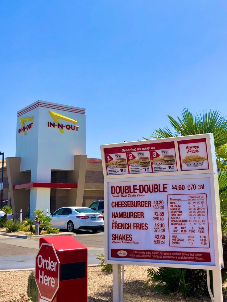 a sign in front of a fast food restaurant