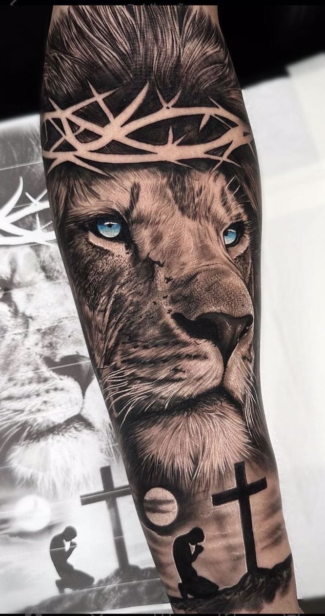 a man's arm with a lion and cross on it