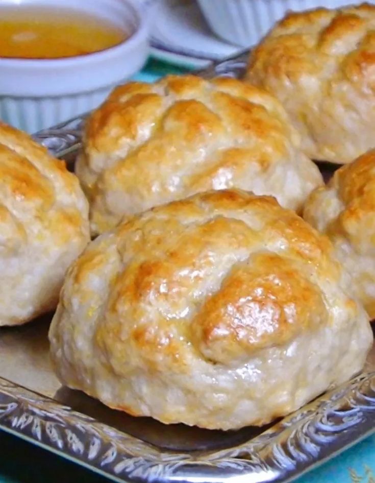 some biscuits sitting on top of a silver plate