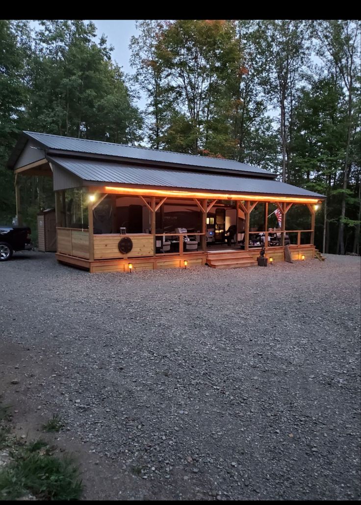 a small building with lights on the outside