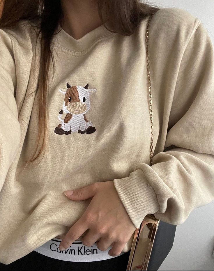 Cow embroidered sweatshirt | cute embroidered crewneck | cottage core sweatshirt | aesthetic sweatshirt | trendy sweatshirt Cow Crewneck Sweatshirt, Cute Embroidered Crewneck, Winter Embroidered Sweatshirt, Cute Embroidered Sweatshirt, Embroidered Clothes Ideas, Cow Sweatshirts, Embroidery Designs Sweatshirt, Embroidery Sweatshirt Ideas, Sweatshirts Ideas