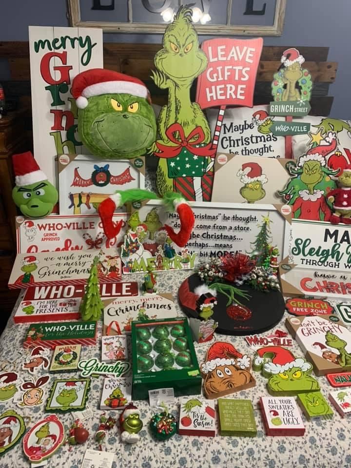 a table topped with lots of christmas cards and decorations on top of a table cloth