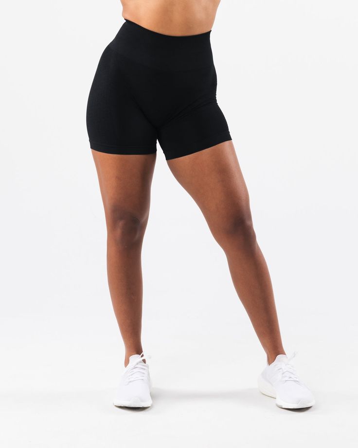 HIGHLIGHTS. High-waisted short 3-tiered tapered waistband Seamless knit fabric No front seam Back scrunch seam detail to enhance curves New leg and glute contouring panels FIT SUGGESTION. This item runs true to Alphalete's standard seamless fit.. We recommend sizing up for a comfortable fit.. Model is 5’7”/170cm, wearing a size M with 40"/101.6cm hips and 27.5”/69.8cm waist. MATERIALS AND WASHING DIRECTIONS. 51% Polyamide, 38% Polyester, 11% Elastane. We recommend washing inside-out on a cold se Black Seamless Activewear With Built-in Shorts, Compressive Workout Shorts Made Of Seamless Fabric, Compressive Seamless Workout Shorts, Compressive Seamless Training Shorts, Fitted Solid Color Squat Proof Shorts, Sporty Compressive Bottoms With Seamless Construction, Supportive Compressive Bottoms With Seamless Construction, Supportive Seamless Workout Bottoms, Fitted Seamless Bottoms For Training