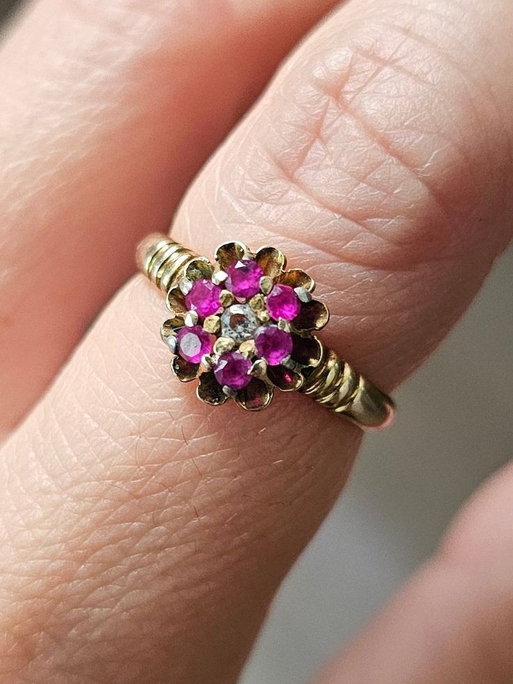 Ruby & Diamond 14K Ring Vintage Women Ruby Flower Ring Size 5.5 Vintage 14K ruby & diamond flower design ring in a very pretty wedding cake setting.  In great, ready to love condition.  Not marked but tests as 14k. Diamond & rubies are natural, mined gemstones.  Currently a size 5.5. Flower-shaped Yellow Gold Wedding Ring For Anniversary, Yellow Gold Flower Wedding Ring For Anniversary, Yellow Gold Flower Ring With 17 Jewels For Anniversary, Vintage Flower Shaped Diamond Ring, Victorian Ruby Cluster Ring For Anniversary, Victorian Ruby Cluster Ring For Wedding, 14k Gold Flower Cluster Ring For Anniversary, Vintage Wedding Ruby Cluster Ring, Formal Red Flower Ring