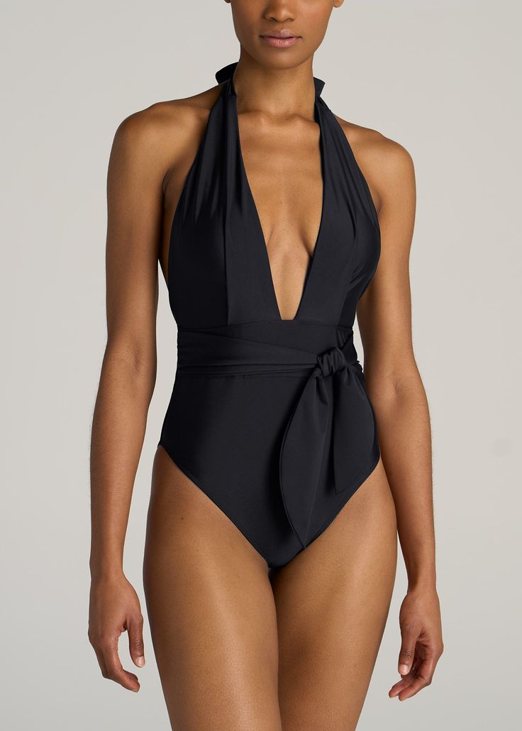 American-Tall-Women-Plunging-Halter-Swimsuit-Black-front Elegant Bodysuit For Sunbathing Beach Season, Chic Black V-neck Swimwear, Elegant V-neck Swimwear For Pool, Chic Triangle Top Swimwear For Evening, Elegant Black Triangle Top Swimwear, Black V-neck Swimwear For Evening, Elegant Swimming Bodysuit With Triangle Top, Elegant Black Swimwear For The Pool, Elegant Triangle Top Bodysuit For Swimming