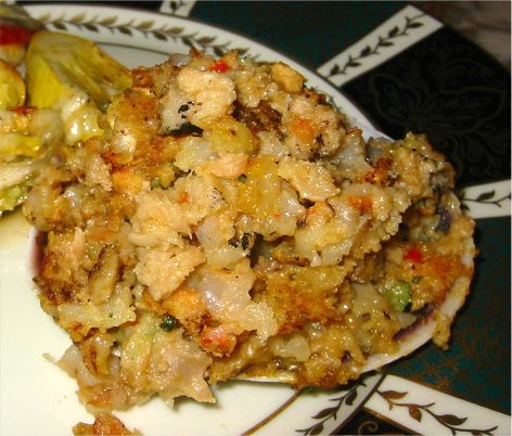 a white plate topped with food and vegetables